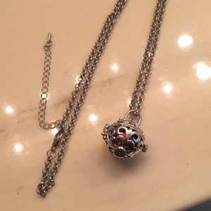 Red Harmony bell ball on 24in’ silver chain